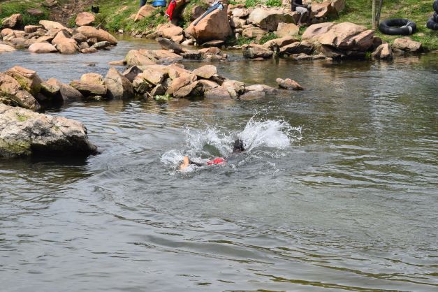 Boy splashing around in the River Nile in Jinja, Uganda